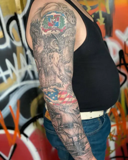 Black and grey sleeve joining the Dominican coat of arms, a bald eagle, and the American flag