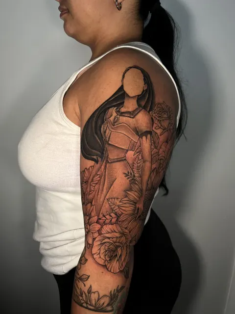Black and grey upper-arm profile of a veiled woman in prayer