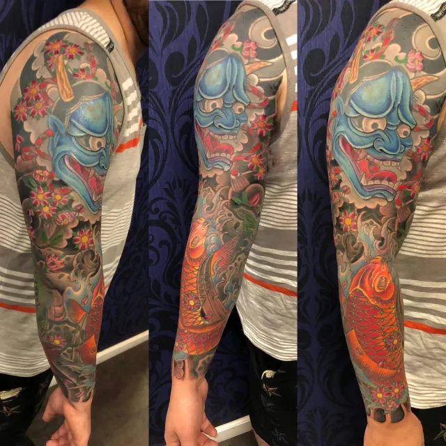 Three views of a neo-oriental sleeve built around a blue hannya mask with red blossoms